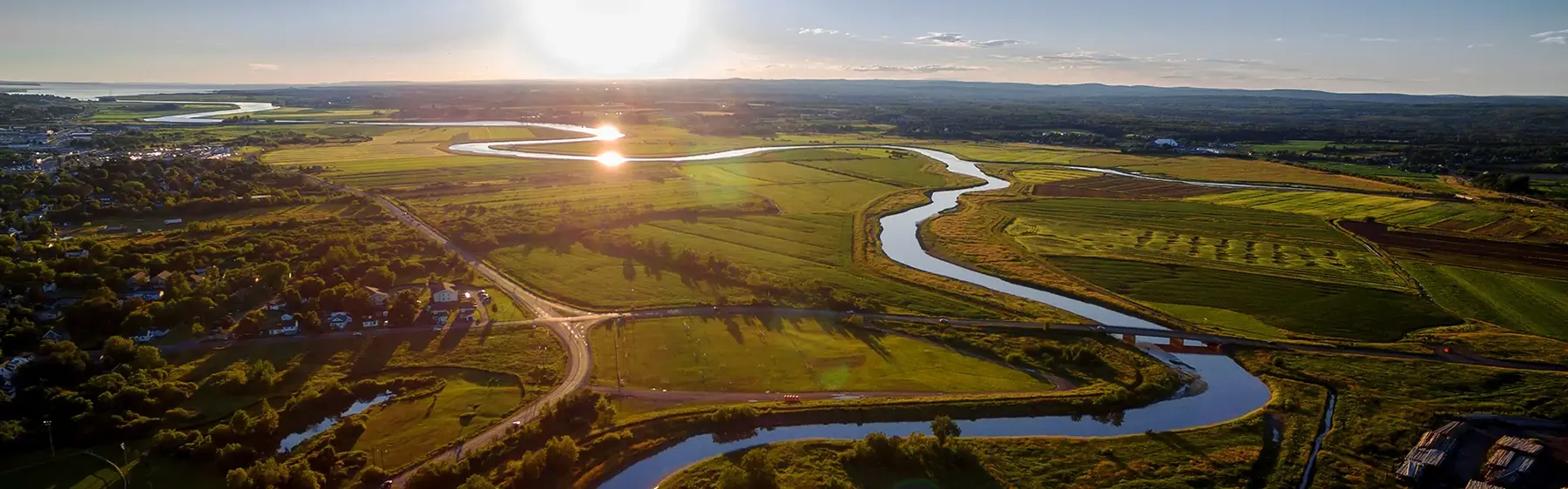 The Salmon River winding through the tidal flats outside Truro, Nova Scotia, at golden hour.